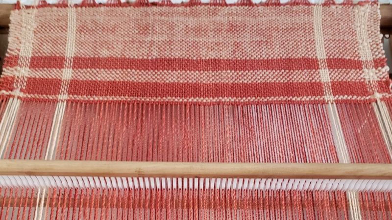 weaving post by weird weekends - red white cloth on rigid heddle loom